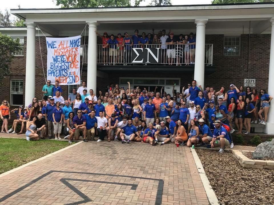 Sigma Nu brothers with their families during parents weekend celebration